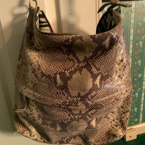 Snake Skin shoulder bag is lightly used outside zipper and back pocket